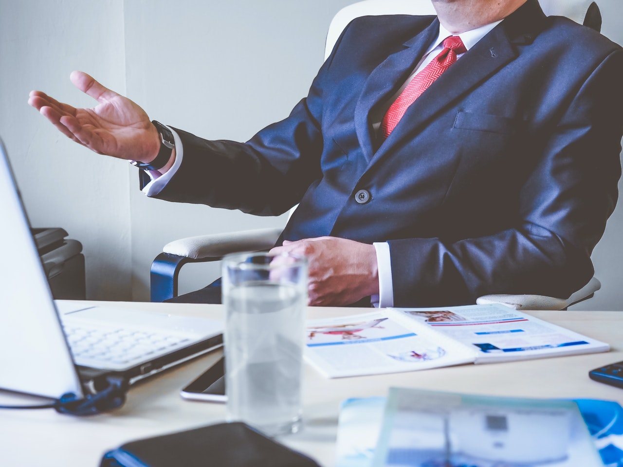 financial services professional desk suit man pexels