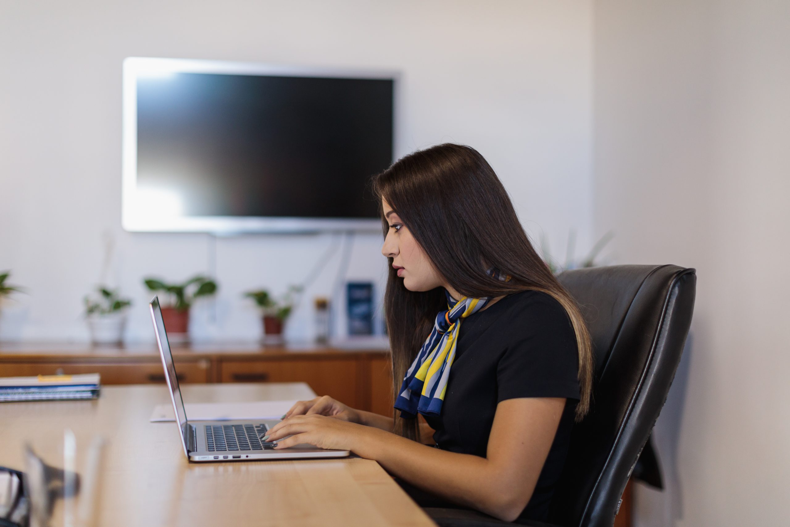 laptop women desk stock