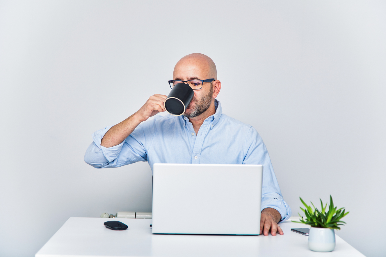 bald middle aged man working